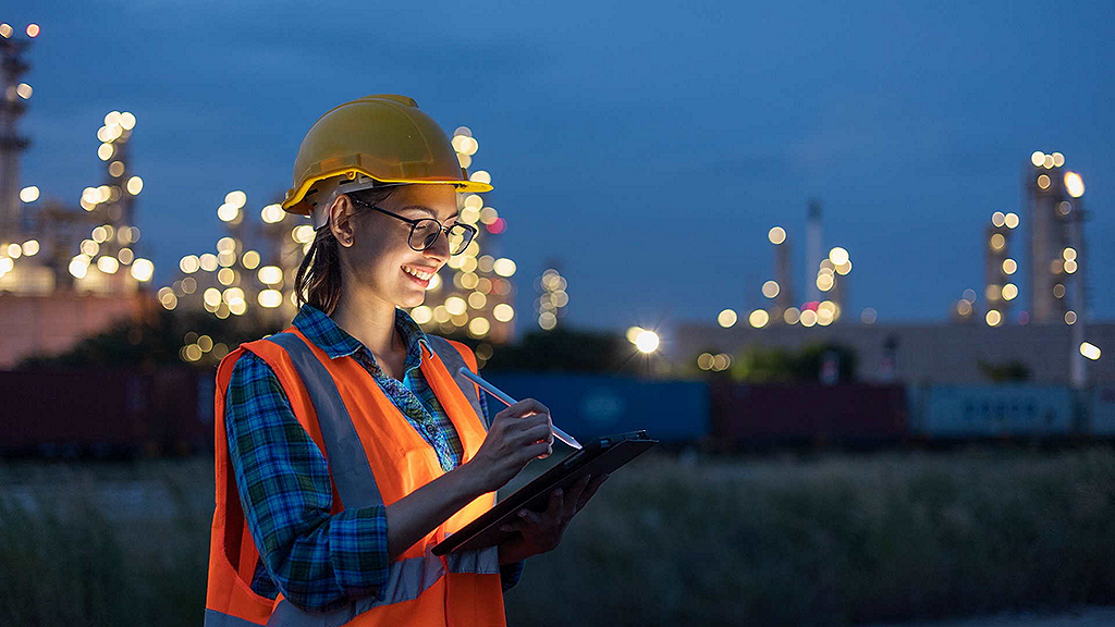 Field engineer monitoring energy infrastructure