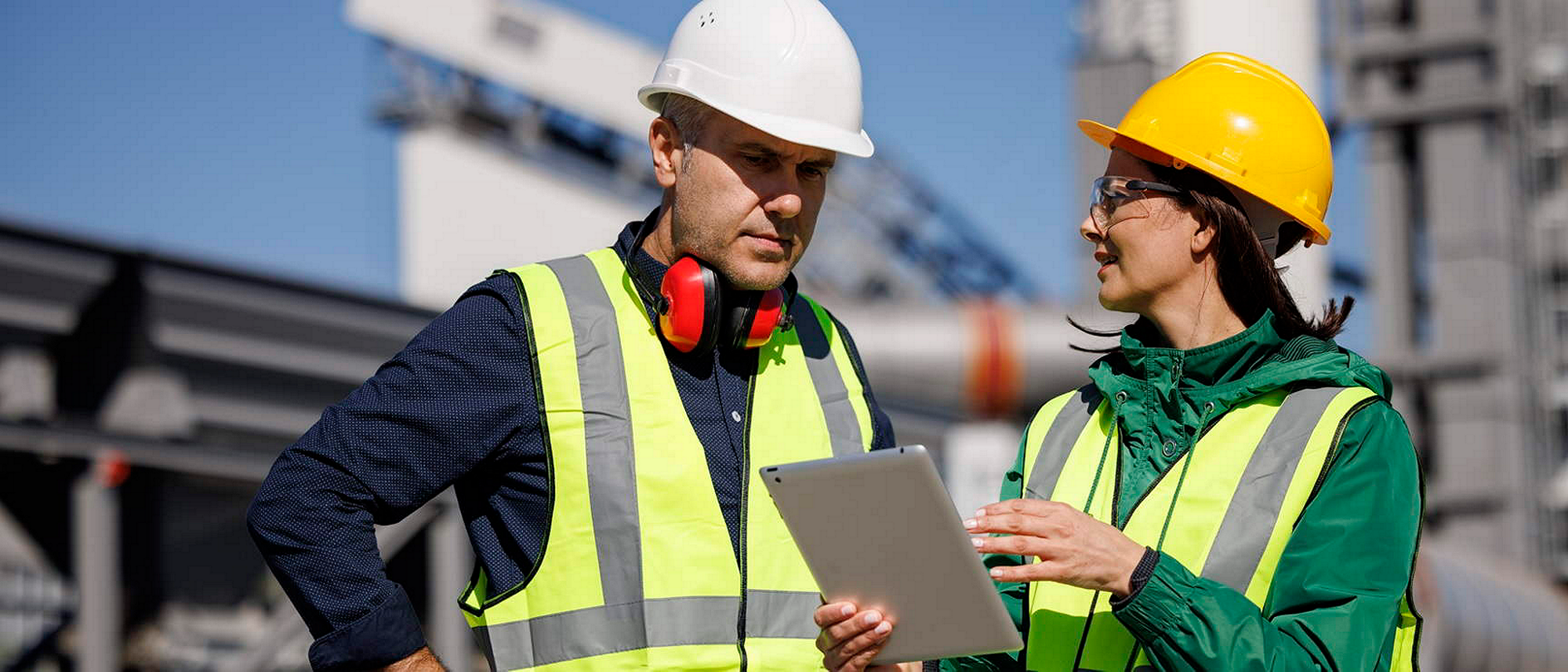 Operations team reviewing digital platform on-site