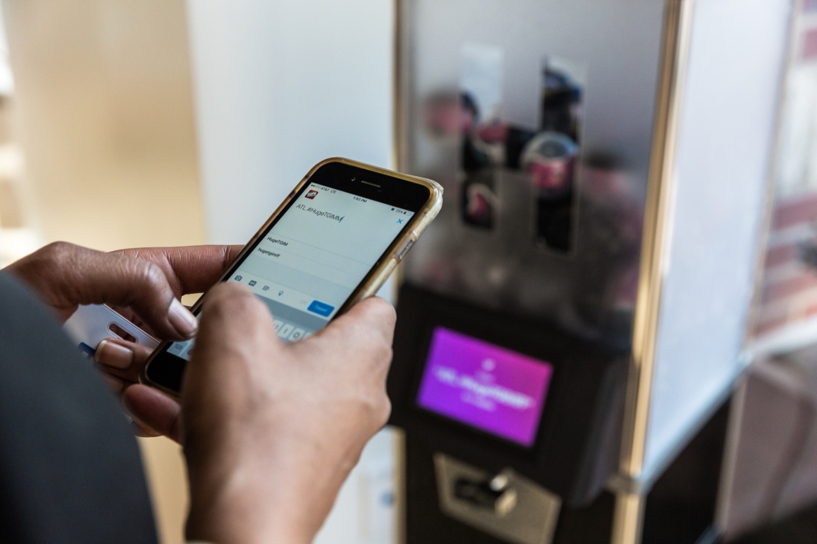 A customer composing a social media post to activate the vending machine
